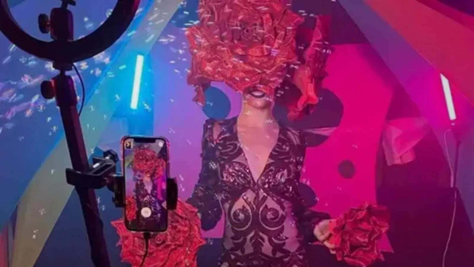 Guest spinning on a 360 platform under neon lights at a night event